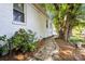 Exterior view of the home with a brick pathway and mature trees at 2109 Brewton Dr, Charlotte, NC 28206