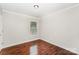 Bedroom with hardwood floors and natural light from the window at 2109 Brewton Dr, Charlotte, NC 28206