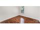 Bedroom featuring hardwood floors and a window for natural light at 2109 Brewton Dr, Charlotte, NC 28206