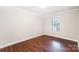 Bright bedroom featuring hardwood floors and a window with blinds at 2109 Brewton Dr, Charlotte, NC 28206