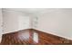 Bedroom with hardwood floors, double closet, and natural light at 2109 Brewton Dr, Charlotte, NC 28206