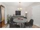 Charming dining room featuring a modern table setting, stylish decor, neutral paint, and hardwood floors at 2109 Brewton Dr, Charlotte, NC 28206