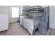 ' bedroom with gray bunk bed and window views at 2141 Bexar Trl, Matthews, NC 28105