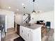 Kitchen island with granite countertops, pendant lighting, and open layout to the living space at 2141 Bexar Trl, Matthews, NC 28105