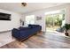 Inviting living room with sliding glass doors opening to the backyard patio at 2141 Bexar Trl, Matthews, NC 28105