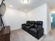 Cozy media room featuring plush seating, neutral carpeting, and a wall-mounted TV at 2141 Bexar Trl, Matthews, NC 28105