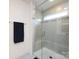 Modern bathroom shower featuring glass doors and decorative tile work at 2141 Bexar Trl, Matthews, NC 28105