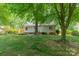 Spacious backyard with a wooden deck and lush green lawn, perfect for outdoor enjoyment at 21614 Colina Dr, Cornelius, NC 28031