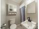 Bathroom with a white sink, toilet, and shower at 21614 Colina Dr, Cornelius, NC 28031