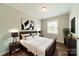 Cozy bedroom with a comfortable bed, modern decor, and ample natural light at 21614 Colina Dr, Cornelius, NC 28031
