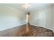 Bedroom featuring wood floors, a ceiling fan, and neutral walls at 21614 Colina Dr, Cornelius, NC 28031