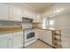 Kitchen with white cabinets, updated appliances, and durable countertops at 21614 Colina Dr, Cornelius, NC 28031