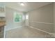 Eat-in kitchen with natural light, neutral paint, and easy access to the backyard at 21614 Colina Dr, Cornelius, NC 28031