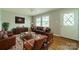 Comfortable living room with hardwood floors and lots of seating at 21614 Colina Dr, Cornelius, NC 28031