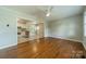 Open living room showcases hardwood floors that flows into the adjacent kitchen at 21614 Colina Dr, Cornelius, NC 28031