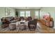 Inviting living room with hardwood floors, leather furniture, and natural light at 21614 Colina Dr, Cornelius, NC 28031