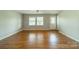 Inviting living room with hardwood floors, neutral paint, and natural light at 21614 Colina Dr, Cornelius, NC 28031