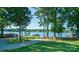 Scenic waterfront lot featuring lush greenery and lake access with docks and stunning water views at 21614 Colina Dr, Cornelius, NC 28031
