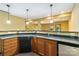 Basement bar area featuring a sink, cabinets and countertop at 2346 Donnington Nw Ln, Concord, NC 28027