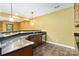 Basement bar area with granite countertop, wine fridge and cabinets at 2346 Donnington Nw Ln, Concord, NC 28027