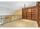 Bonus room with built-in bookshelves and wrought iron banister at 2346 Donnington Nw Ln, Concord, NC 28027