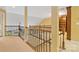 Second story hallway with wrought iron banister and built-in shelving at 2346 Donnington Nw Ln, Concord, NC 28027