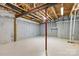 Unfinished basement with exposed beams, concrete walls and painted floors at 2346 Donnington Nw Ln, Concord, NC 28027