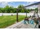 Relaxing backyard with a pergola, swing and seating area surrounded by a well-maintained lawn and white vinyl fence at 2423 Dewey Creek Ln, Charlotte, NC 28216