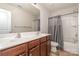 Bathroom with double vanity, a large mirror, and a shower-tub combo at 2423 Dewey Creek Ln, Charlotte, NC 28216