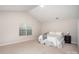 Bright bedroom with vaulted ceiling, soft carpet, and window at 2423 Dewey Creek Ln, Charlotte, NC 28216
