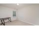 Neutral bedroom with lots of light and a simple desk at 2423 Dewey Creek Ln, Charlotte, NC 28216