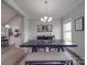 Open-concept dining room with modern light fixture and kitchen view, perfect for Gathering gatherings at 2608 Henry Baucom Rd, Monroe, NC 28110