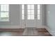 Bright entryway with a glass paneled front door and hardwood flooring adding a clean, welcoming feel at 2608 Henry Baucom Rd, Monroe, NC 28110