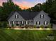 Charming traditional home featuring a well-manicured lawn and inviting front porch at 2608 Henry Baucom Rd, Monroe, NC 28110