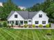Charming traditional home featuring a well-manicured lawn and inviting front porch at 2608 Henry Baucom Rd, Monroe, NC 28110