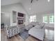 Comfortable living room with a stone fireplace, creating a cozy and inviting atmosphere for relaxation at 2608 Henry Baucom Rd, Monroe, NC 28110