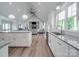 Spacious kitchen view into living room, lots of natural light, and hardwood floors at 2608 Henry Baucom Rd, Monroe, NC 28110