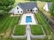 Beautiful home with a fenced backyard, patio area, and a uniquely shaped pool at 2608 Henry Baucom Rd, Monroe, NC 28110