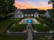 Beautiful home with a fenced backyard, patio area, and a uniquely shaped pool at 2608 Henry Baucom Rd, Monroe, NC 28110