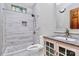 Bathroom features tiled shower, gray vanity, and modern fixtures at 261 Melrose Sw Dr, Concord, NC 28025