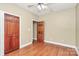 Bedroom with a ceiling fan, hardwood floors, and natural light perfect for a cozy atmosphere at 261 Melrose Sw Dr, Concord, NC 28025