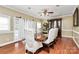 Formal dining room featuring hardwood floors and a large table at 261 Melrose Sw Dr, Concord, NC 28025