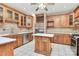 Functional kitchen featuring wooden cabinets, a center island, and stainless steel appliances at 261 Melrose Sw Dr, Concord, NC 28025