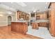 Well-appointed kitchen with wooden cabinets, central island, and a stylish design for culinary enthusiasts at 261 Melrose Sw Dr, Concord, NC 28025