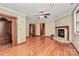 Large living room with hardwood floors, recessed lighting, and a fireplace with a tiled hearth at 261 Melrose Sw Dr, Concord, NC 28025