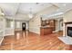 Expansive living room with hardwood floors, fireplace, and an open layout for entertaining and relaxation at 261 Melrose Sw Dr, Concord, NC 28025