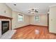 Large living room featuring hardwood floors, recessed lighting, a fireplace, and natural light at 261 Melrose Sw Dr, Concord, NC 28025