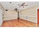 Spacious living room with hardwood floors and multiple ceiling fans at 261 Melrose Sw Dr, Concord, NC 28025