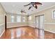 Bright living room with hardwood floors, ceiling fans, and natural light at 261 Melrose Sw Dr, Concord, NC 28025