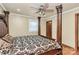 Primary bedroom featuring a decorative wooden bed frame, wood floors, ceiling fan, and neutral paint at 261 Melrose Sw Dr, Concord, NC 28025